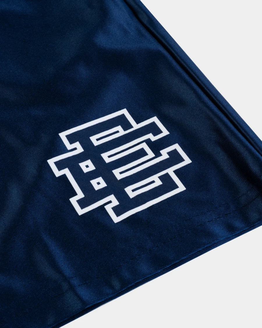 Close-up of blue fabric with white logo on designer athletic shorts blue from My Store