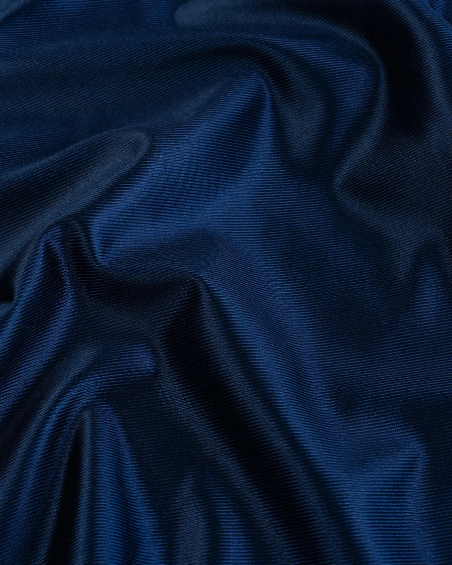 Close-up of blue textured fabric suitable for designer athletic shorts blue