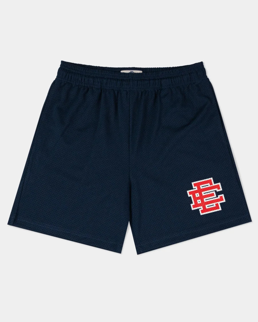 Eric Emanuel navy shorts with elastic waistband and red logo patch on left leg